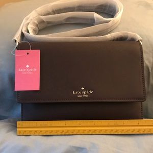 Kate Spade Cross  Body purse in brown color.